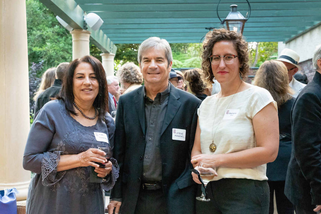 LARB Books Assistant Director Stephanie Malak and guests at the LARB Luminary Dinner, Coriolis client event