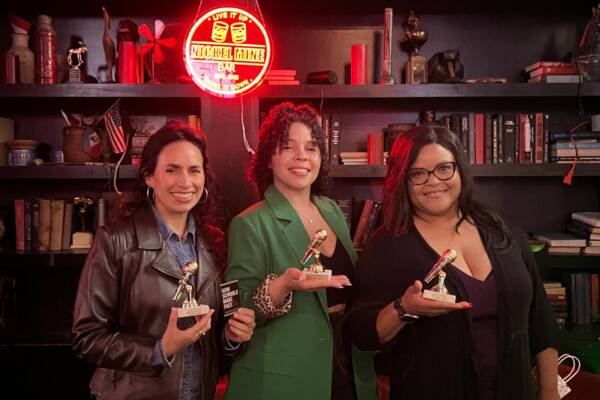 Brains Uncorked Inaugural Night with Professors Laura Chávez-Moreno, Brittany Friedman, and Donna J. Nicol holding up their speaker trophies.